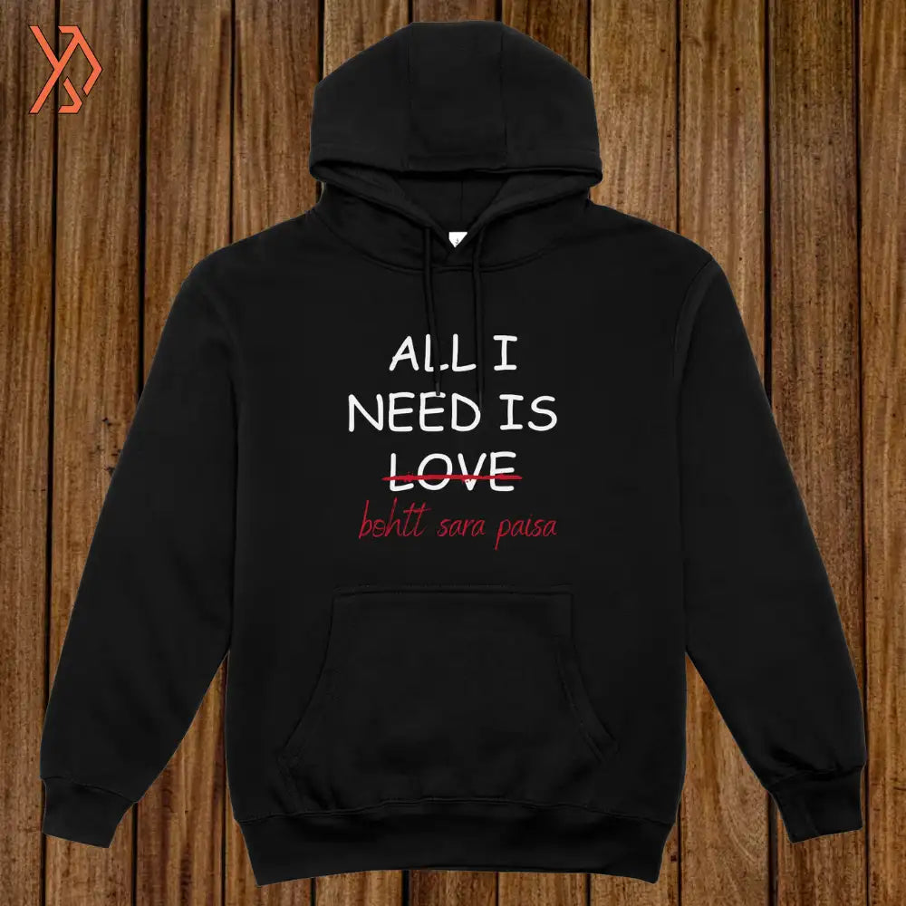 Black hoodie with text 'ALL I NEED IS LOVE' on a wooden background